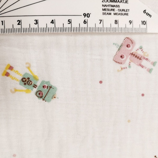 Tissu double gaze de coton  imprimé petits robots coloris blanc