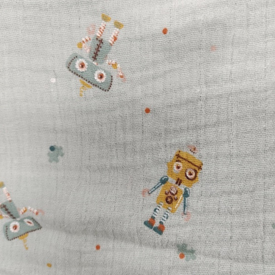 Tissu double gaze de coton  imprimé petits robots coloris vert