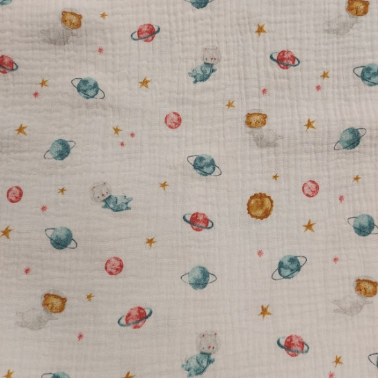 Tissu double gaze de coton  imprimé planètes coloris blanc