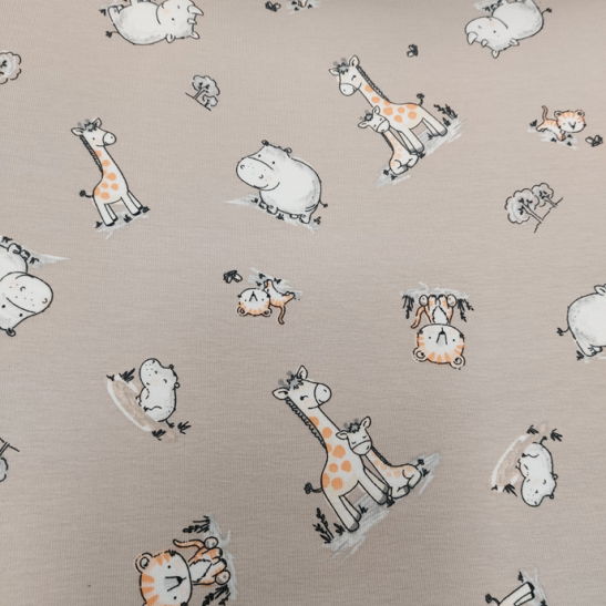 Jersey printed material with girafe and hippo color beige