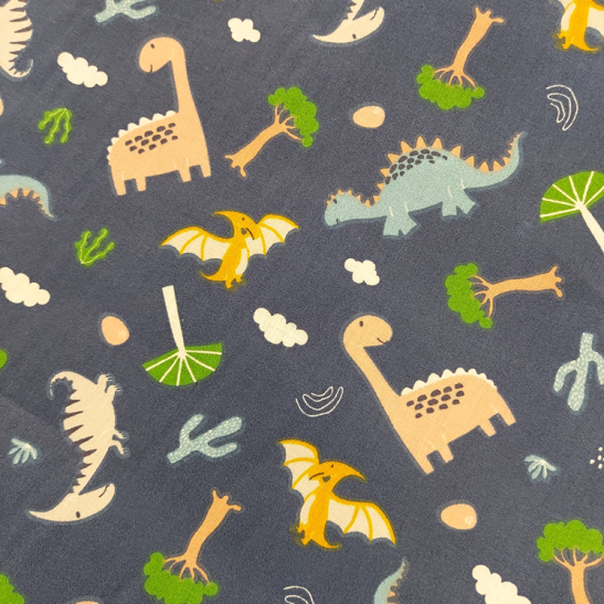 Tissu coton enfant imprimé dinosaure fond bleu marine