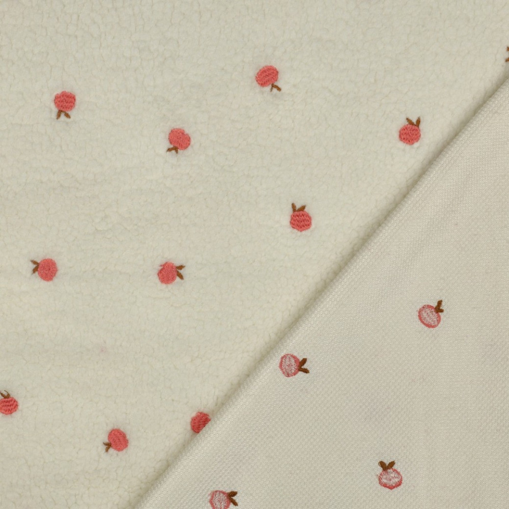 Tissu sherpa brodé pêches coloris écru