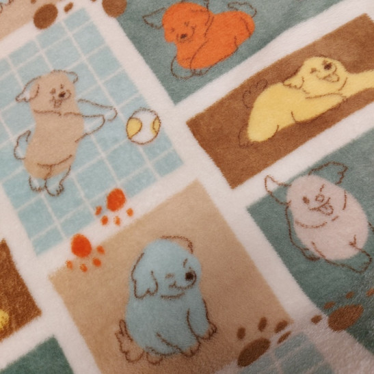 Polar fleece material  printed with puppies